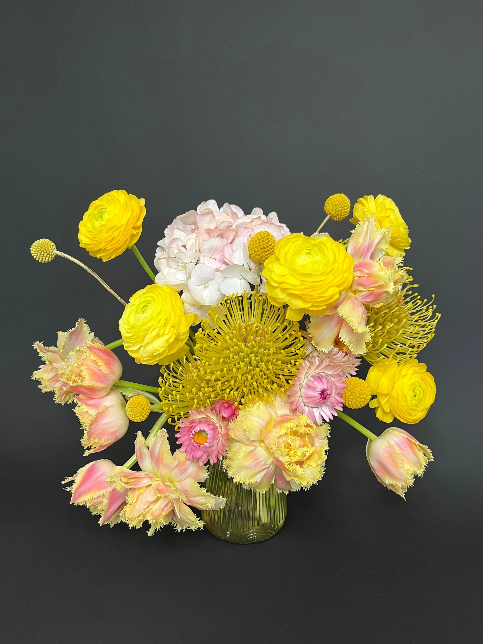 Floral arrangement showcasing intentional design with layered textures and natural forms